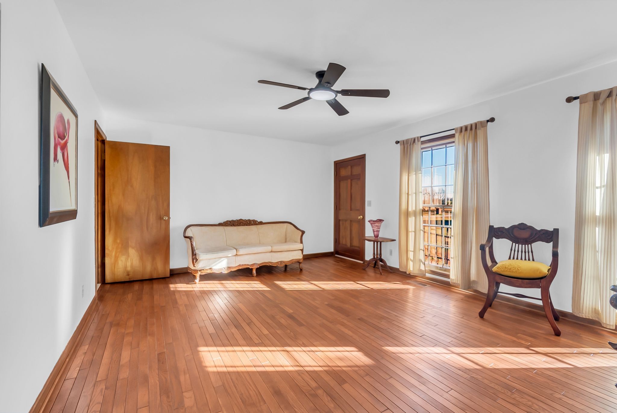104 Glendale Road Loretto, TN 38469 - Photo 17 of 45 a bedroom with a bed and wooden floor