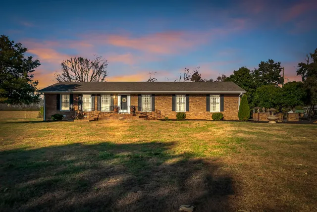 a kitchen with stainless steel appliances granite countertop a refrigerator and a stove