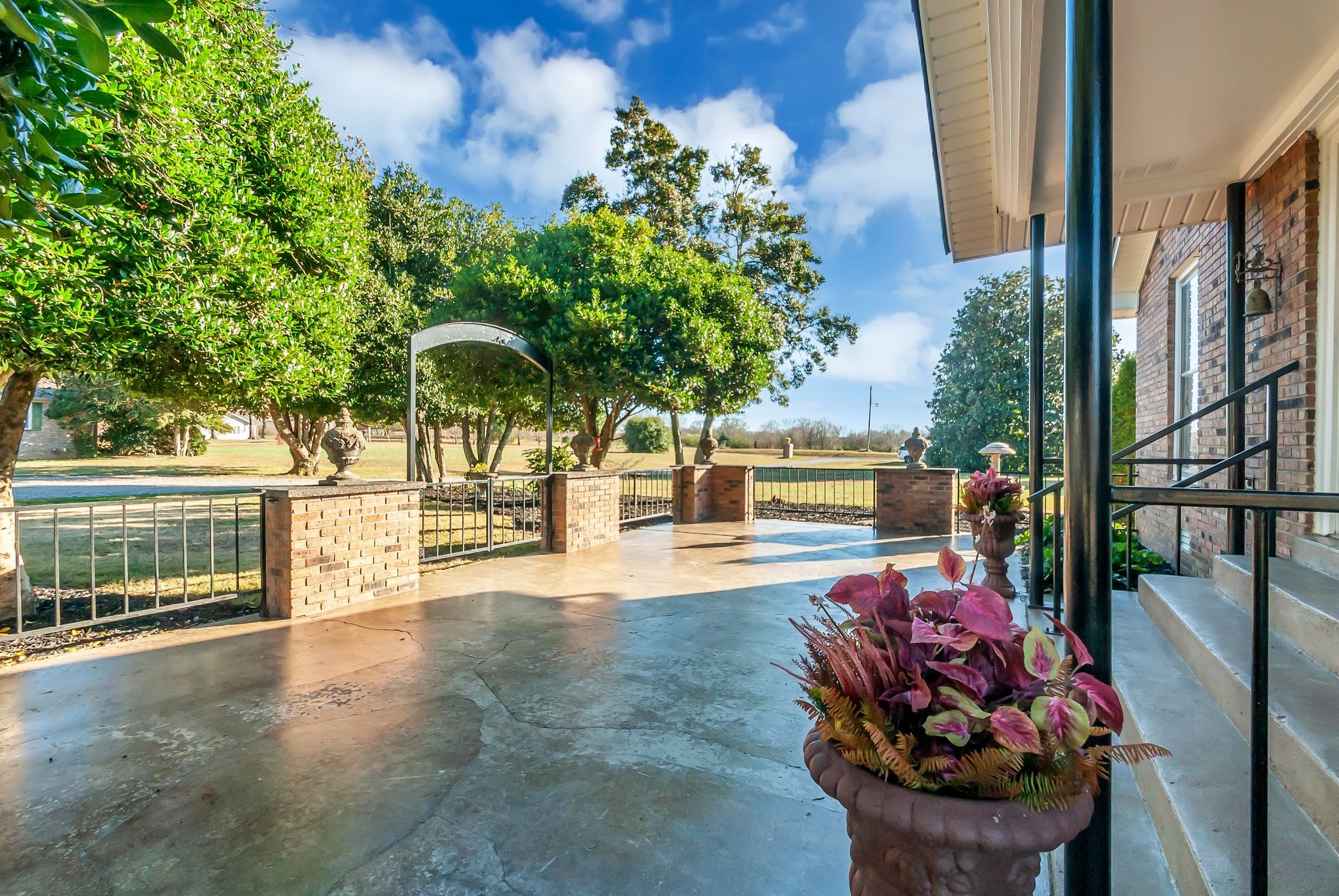 104 Glendale Road Loretto, TN 38469 - Photo 33 of 46 a view of a patio with table and chairs and potted plants