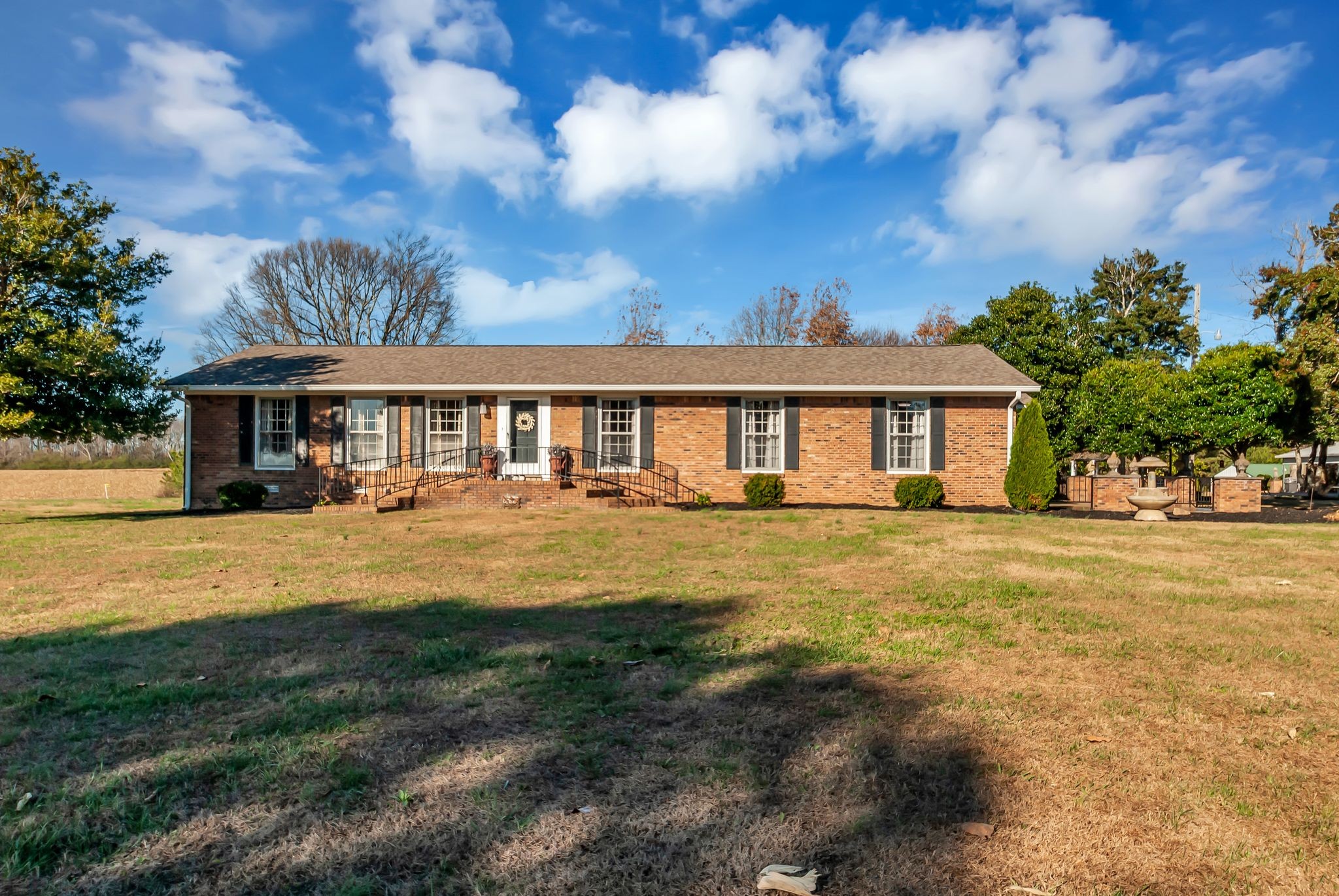 104 Glendale Road Loretto, TN 38469 - Photo 4 of 46 a view of a house with swimming pool and a yard