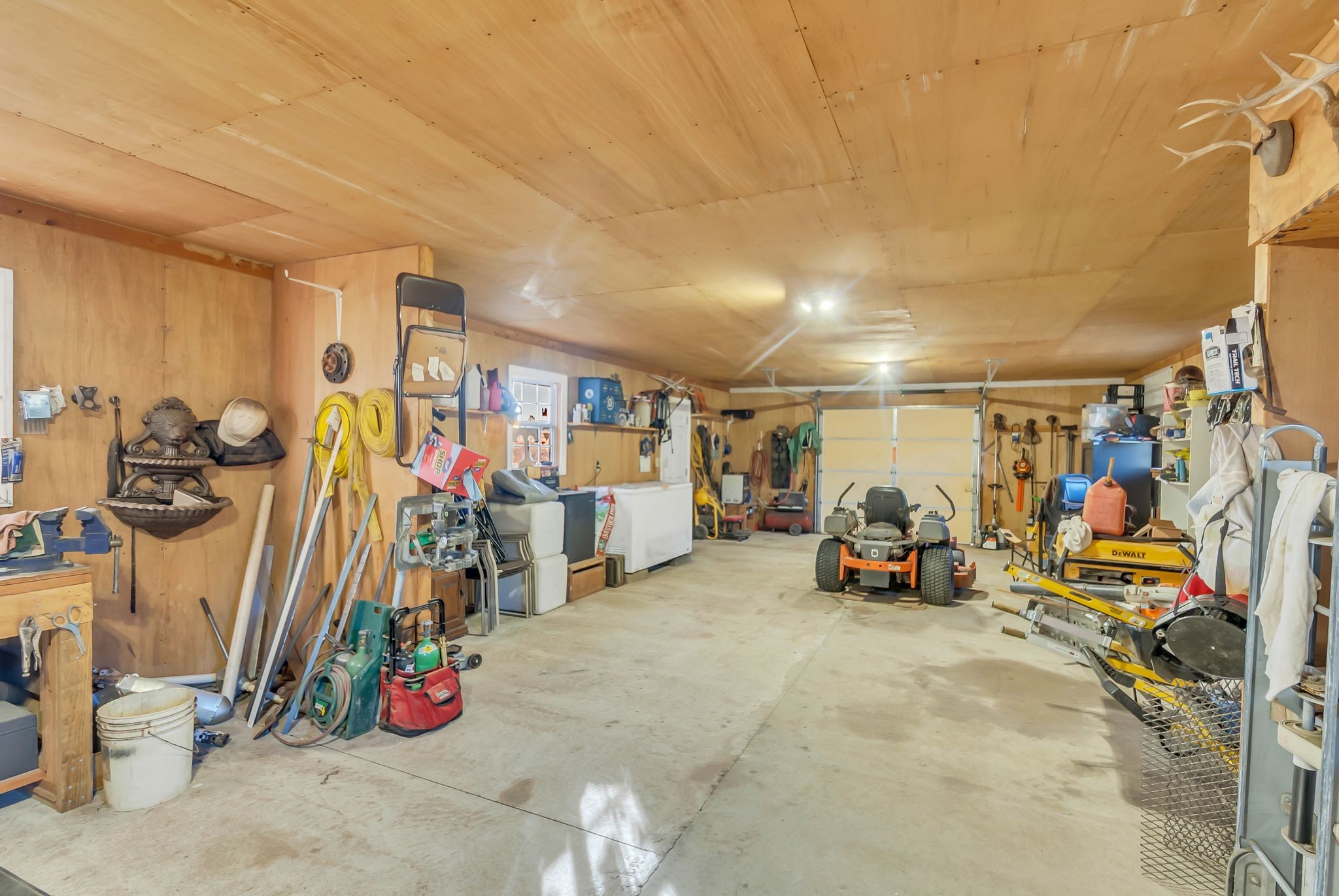 104 Glendale Road Loretto, TN 38469 - Photo 42 of 46 a view of a garage with a bike and car
