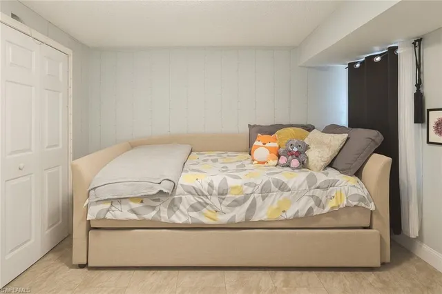 a en suite spacious bedroom with a bed and a couch