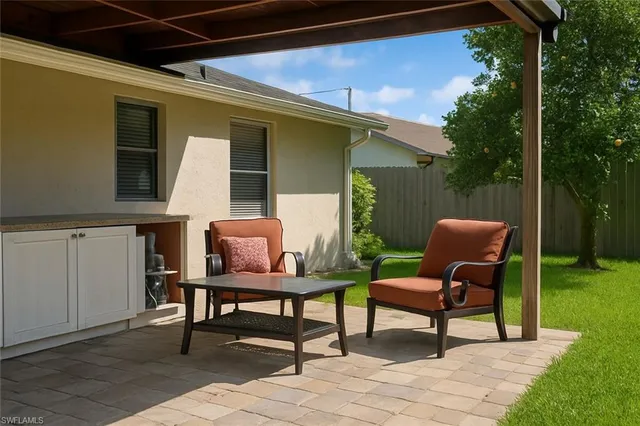 a view of a table and chairs in the garden