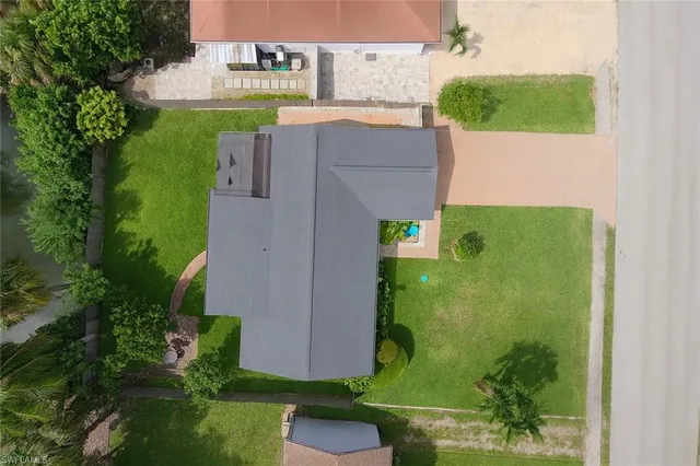 a backyard of a house with outdoor seating