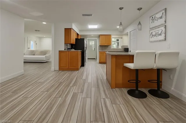 an aerial view of a house with outdoor space pool seating area and yard