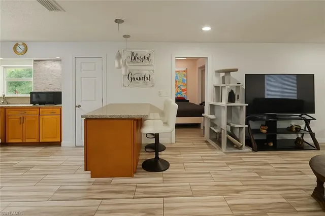 a view of kitchen with cabinets and wooden floor