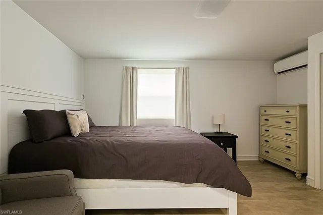 a kitchen with stainless steel appliances granite countertop a stove top oven a sink dishwasher and cabinets with wooden floor