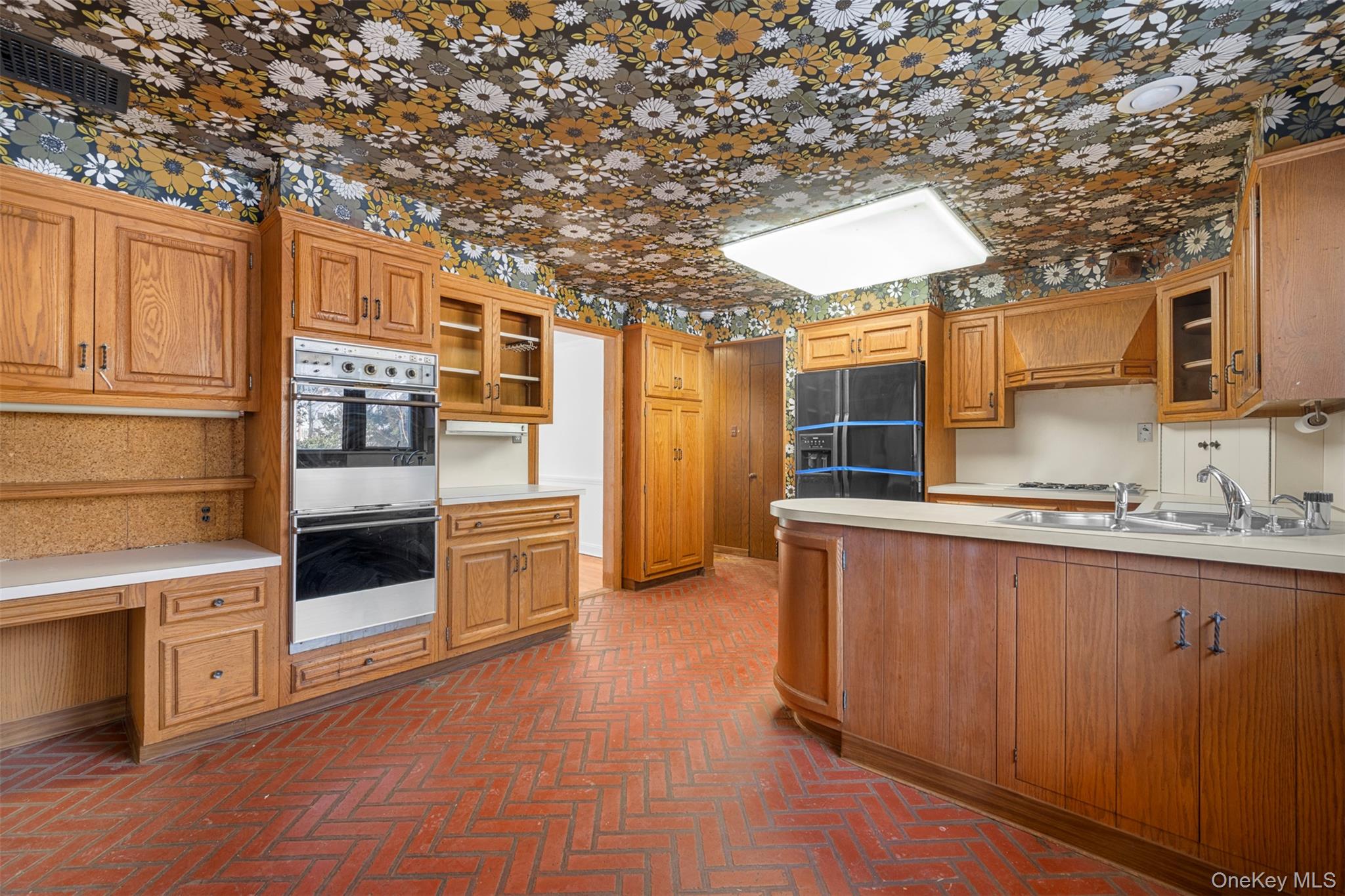 66 Deepdale Drive Great Neck, NY 11021 - Photo 11 of 48 a kitchen with stainless steel appliances granite countertop a stove and a refrigerator