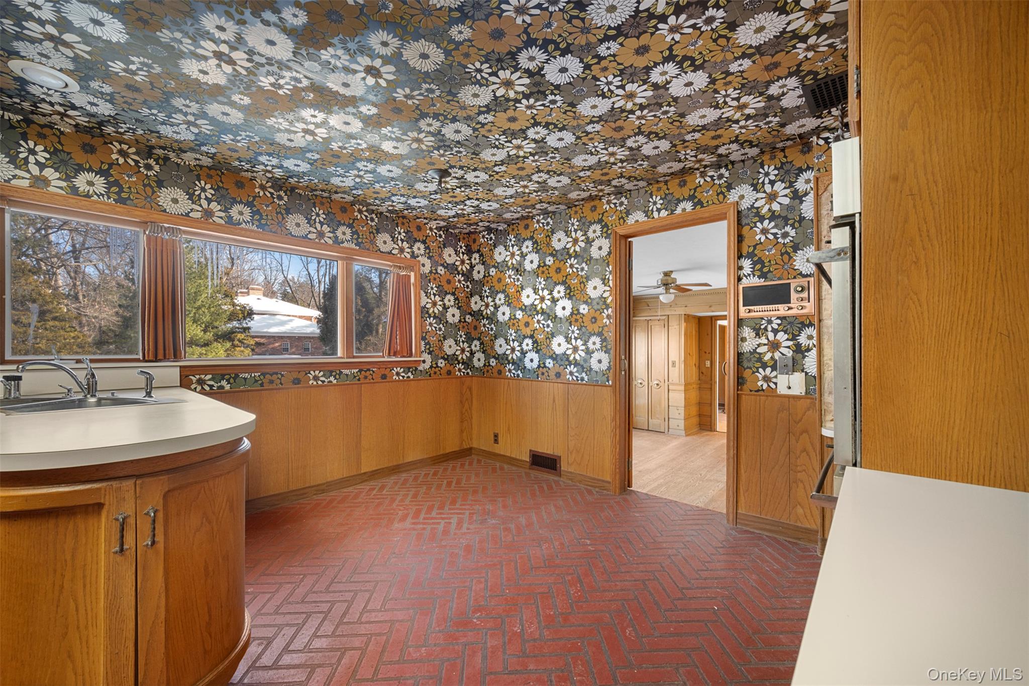 66 Deepdale Drive Great Neck, NY 11021 - Photo 12 of 48 a view of a kitchen with a sink and a large window