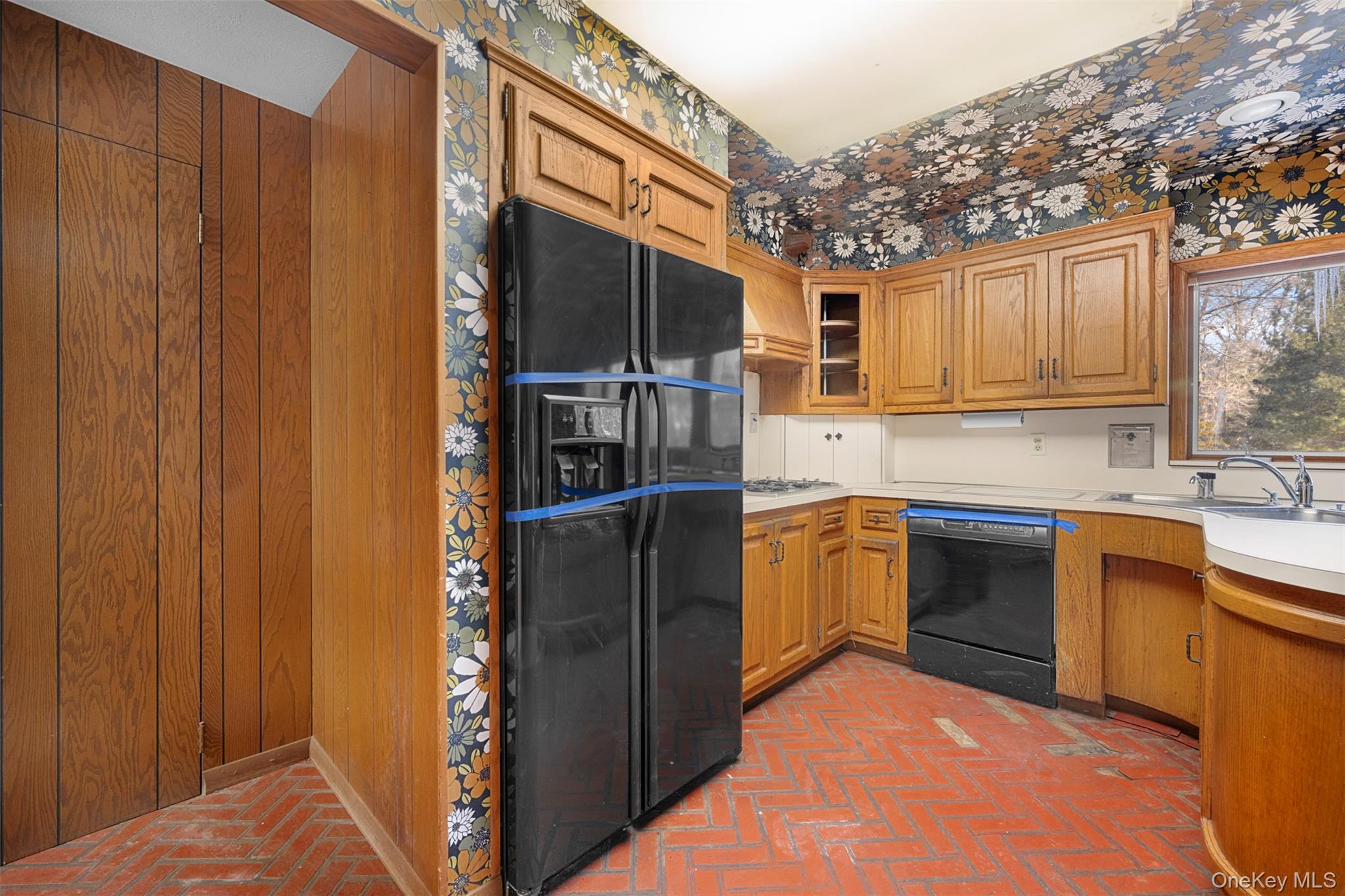 66 Deepdale Drive Great Neck, NY 11021 - Photo 13 of 48 a kitchen with a refrigerator and a sink