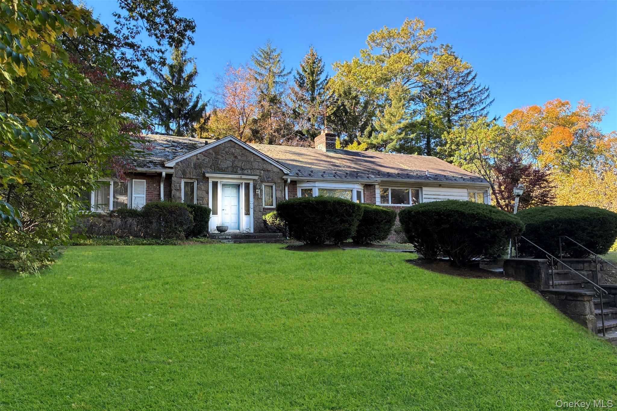 66 Deepdale Drive Great Neck, NY 11021 - Photo 2 of 48 a front view of a house with a garden
