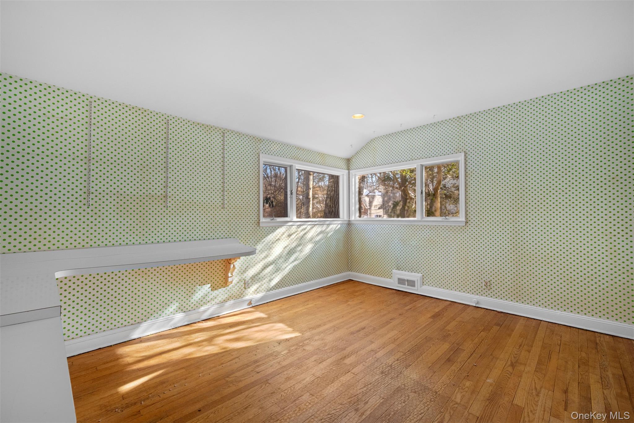 66 Deepdale Drive Great Neck, NY 11021 - Photo 23 of 48 a view of a room with wooden floor and window