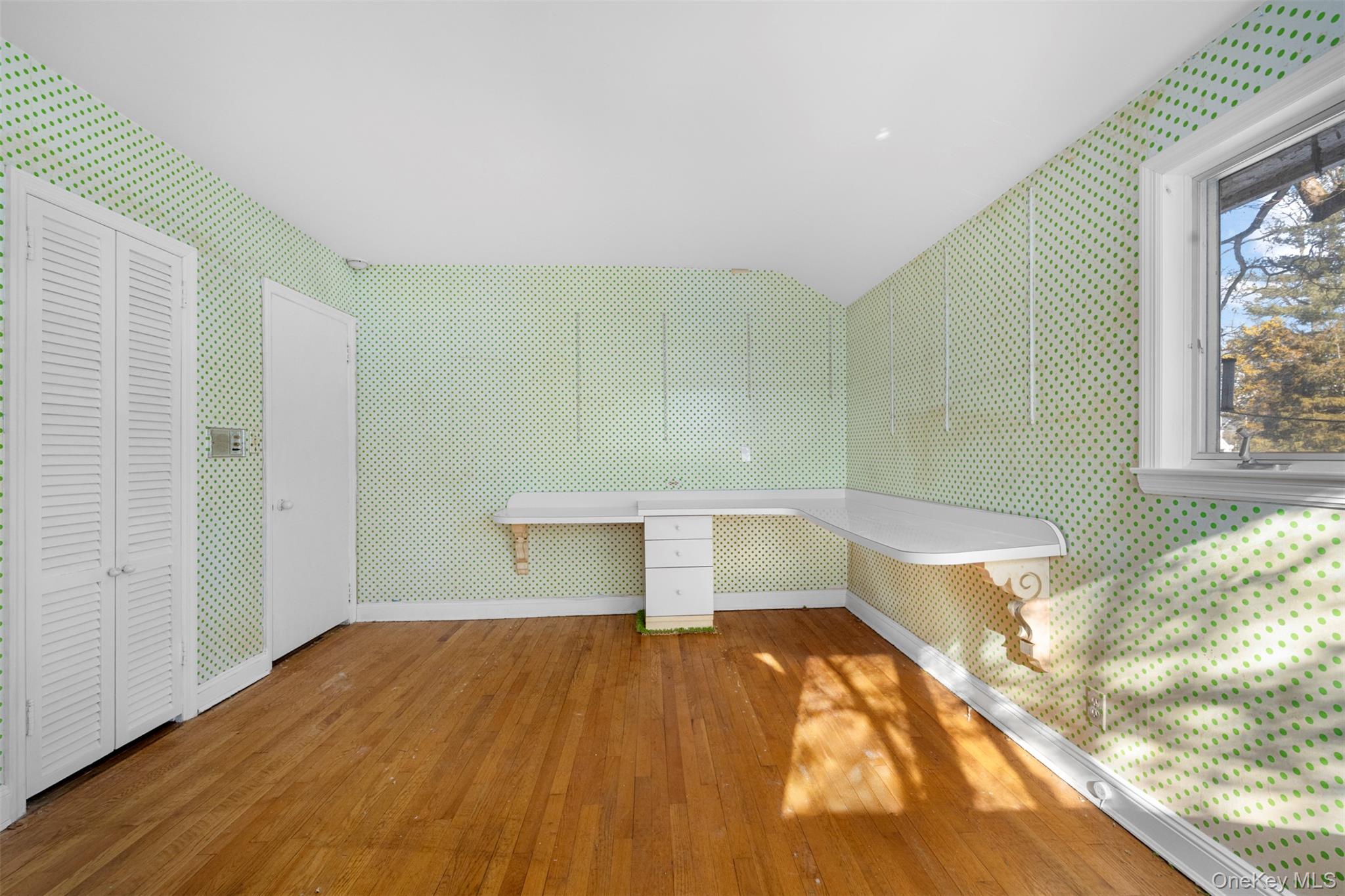 66 Deepdale Drive Great Neck, NY 11021 - Photo 25 of 48 a bedroom with a bed and a window