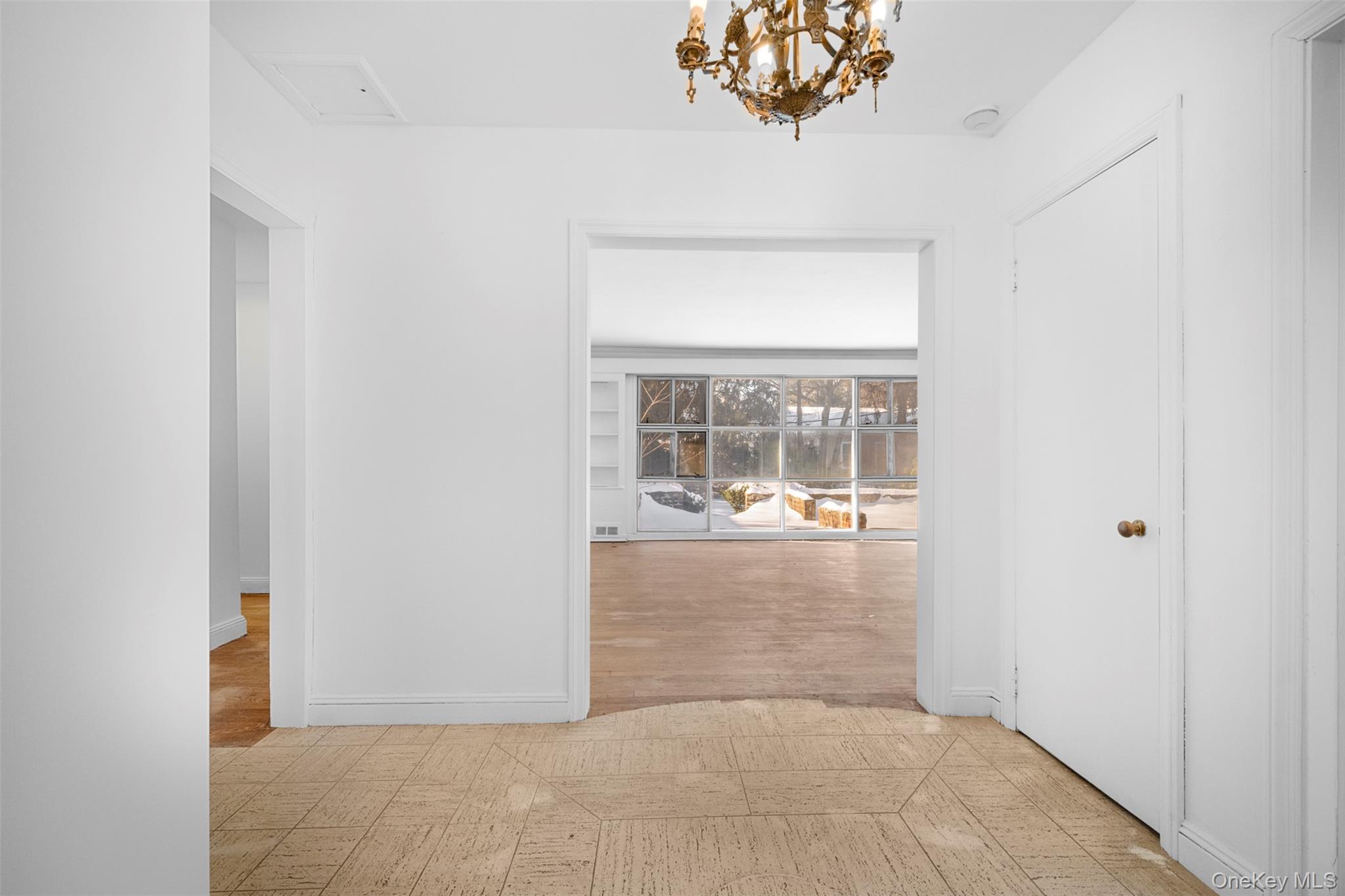 66 Deepdale Drive Great Neck, NY 11021 - Photo 3 of 48 an empty room with windows