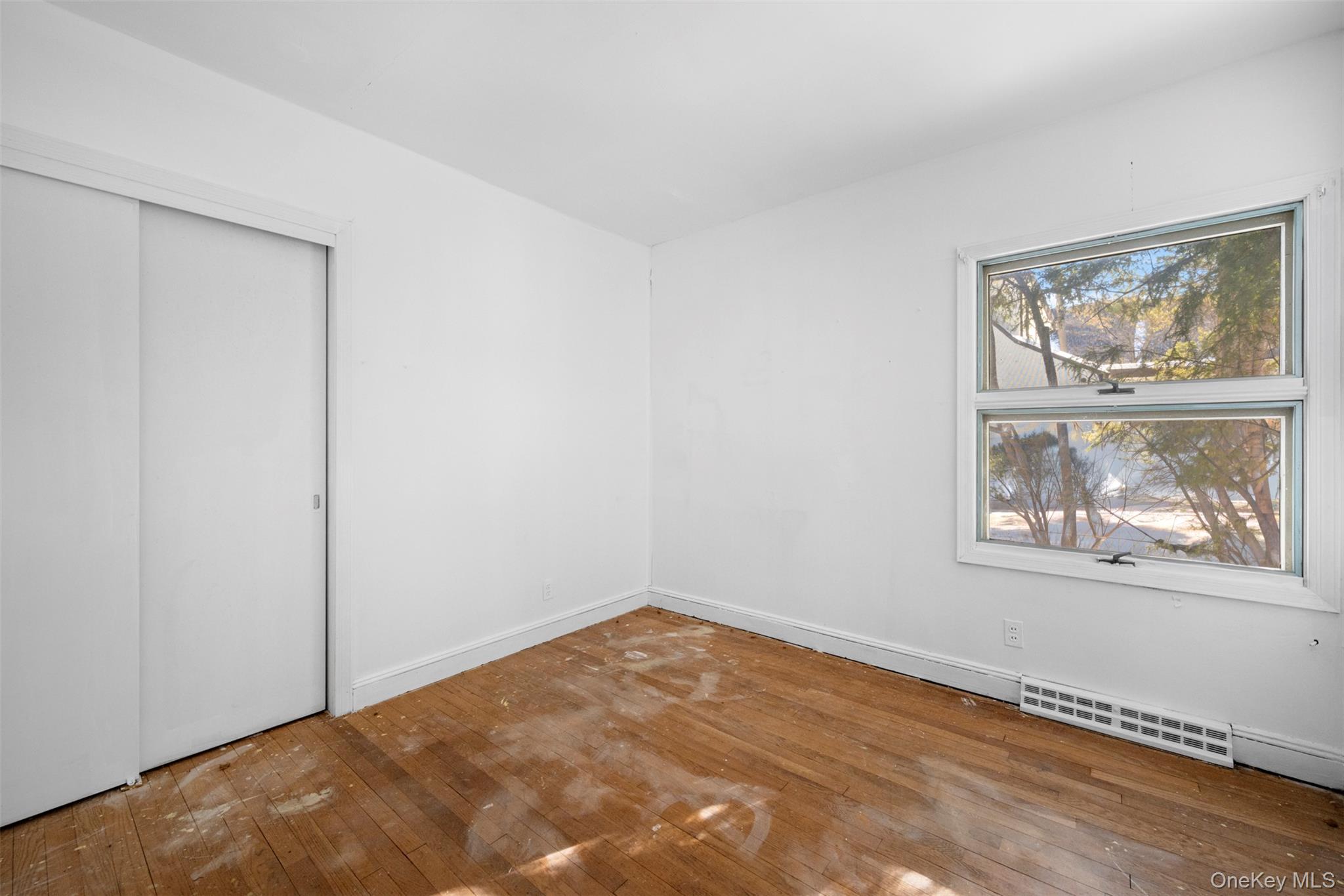 66 Deepdale Drive Great Neck, NY 11021 - Photo 34 of 48 an empty room with windows