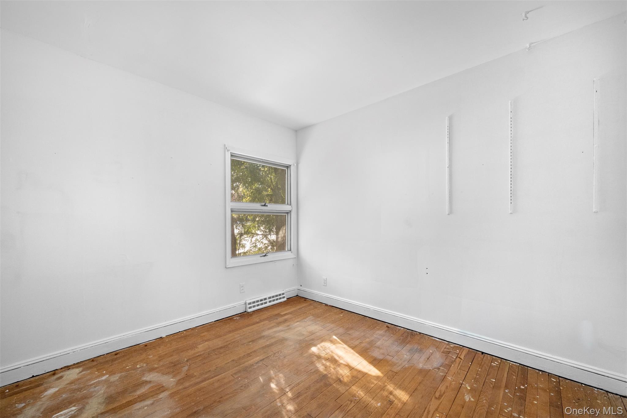 66 Deepdale Drive Great Neck, NY 11021 - Photo 35 of 48 an empty room with a window