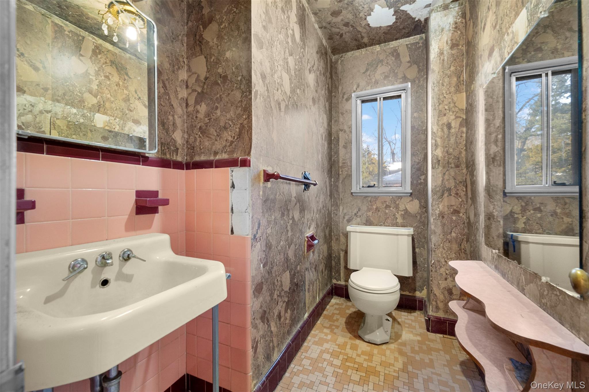 66 Deepdale Drive Great Neck, NY 11021 - Photo 37 of 48 a bathroom with a sink and a toilet