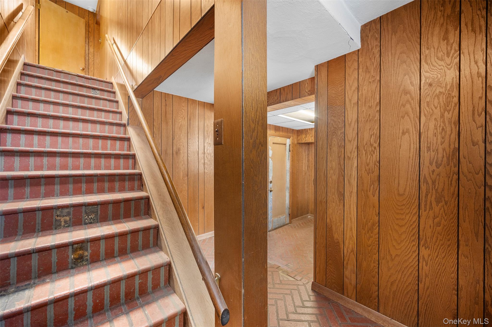 66 Deepdale Drive Great Neck, NY 11021 - Photo 39 of 48 a view of staircase with wooden floor and cabinets