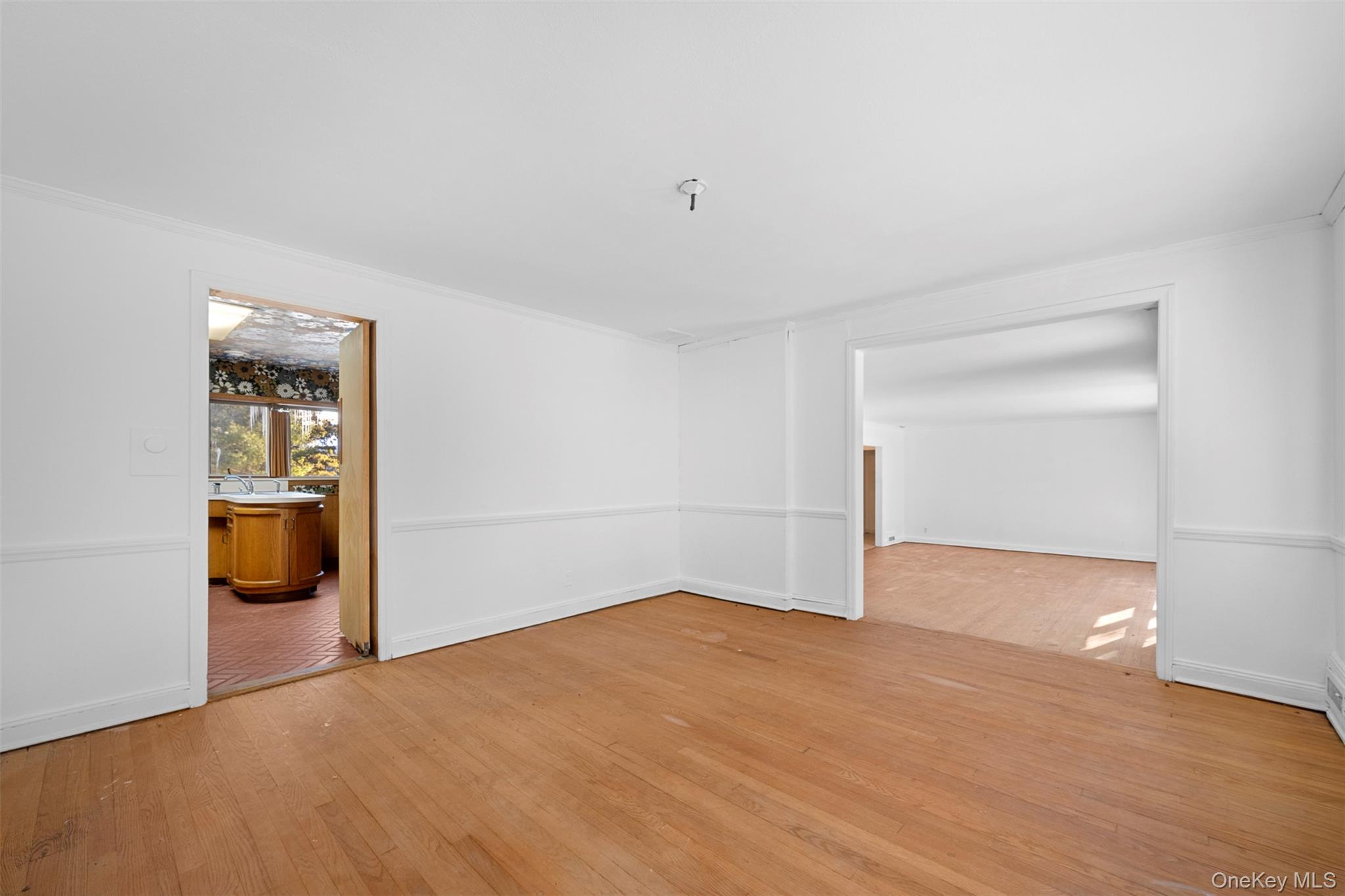 66 Deepdale Drive Great Neck, NY 11021 - Photo 9 of 48 a view of empty room with wooden floor