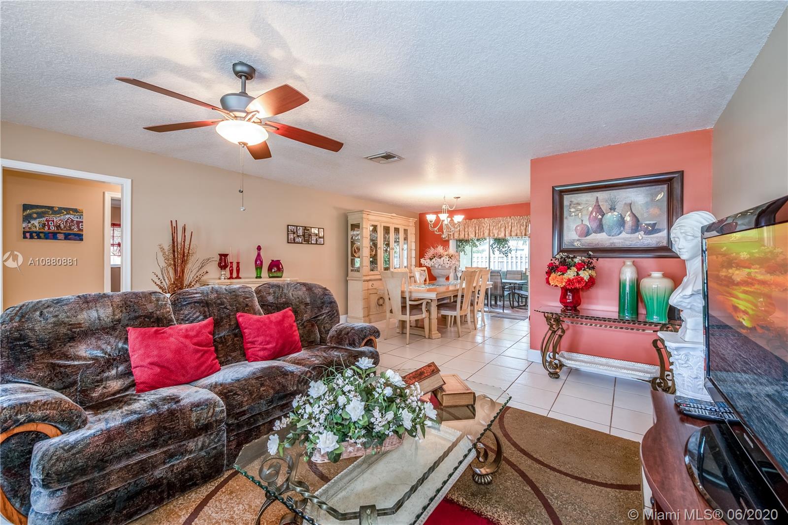8884 Southwest 6th Street Boca Raton, FL 33433 - Photo 15 of 39 a living room with furniture and a flat screen tv