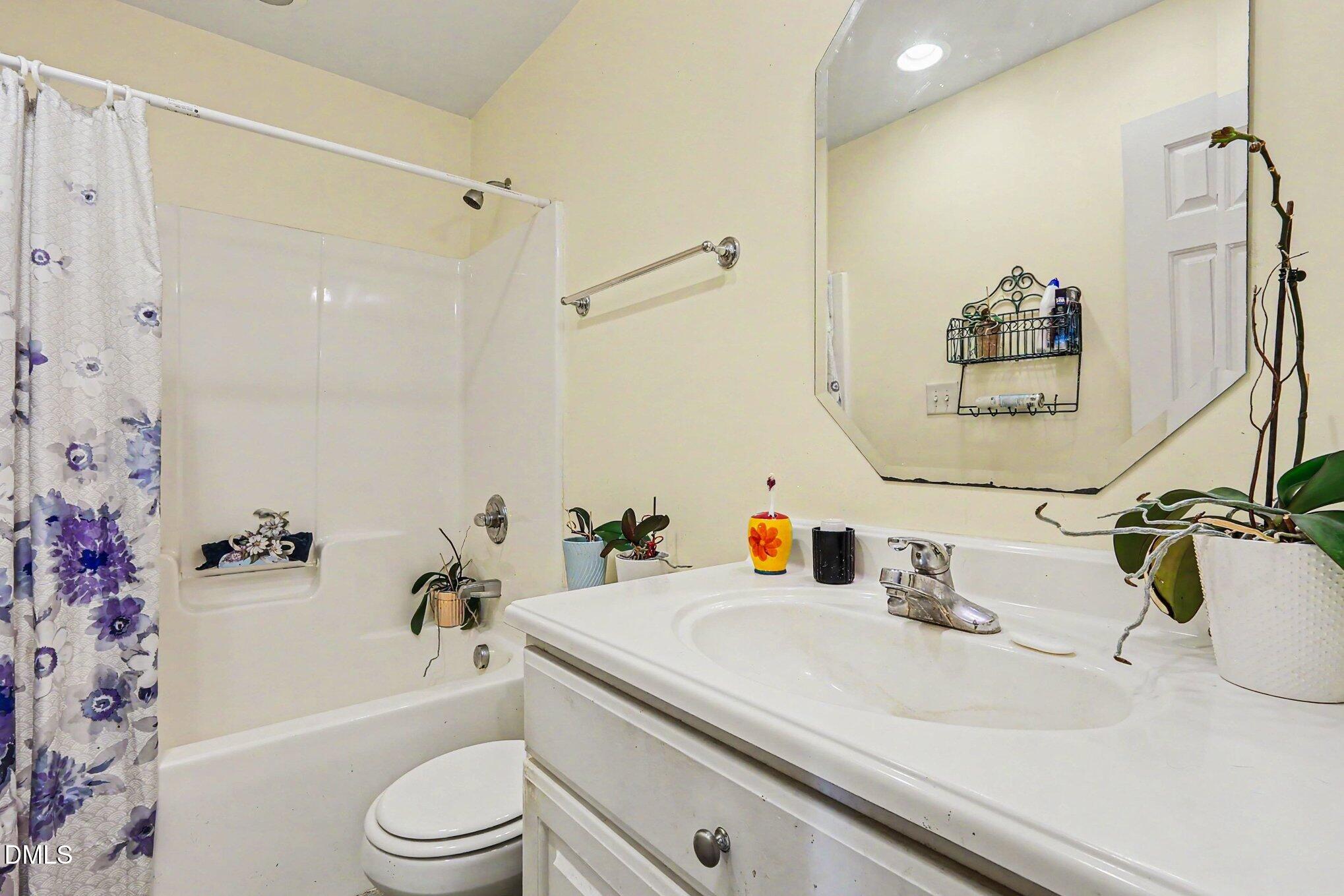 1750 Tom Oakley Road Timberlake, NC 27583 - Photo 20 of 31 a bathroom with a sink a toilet and shower