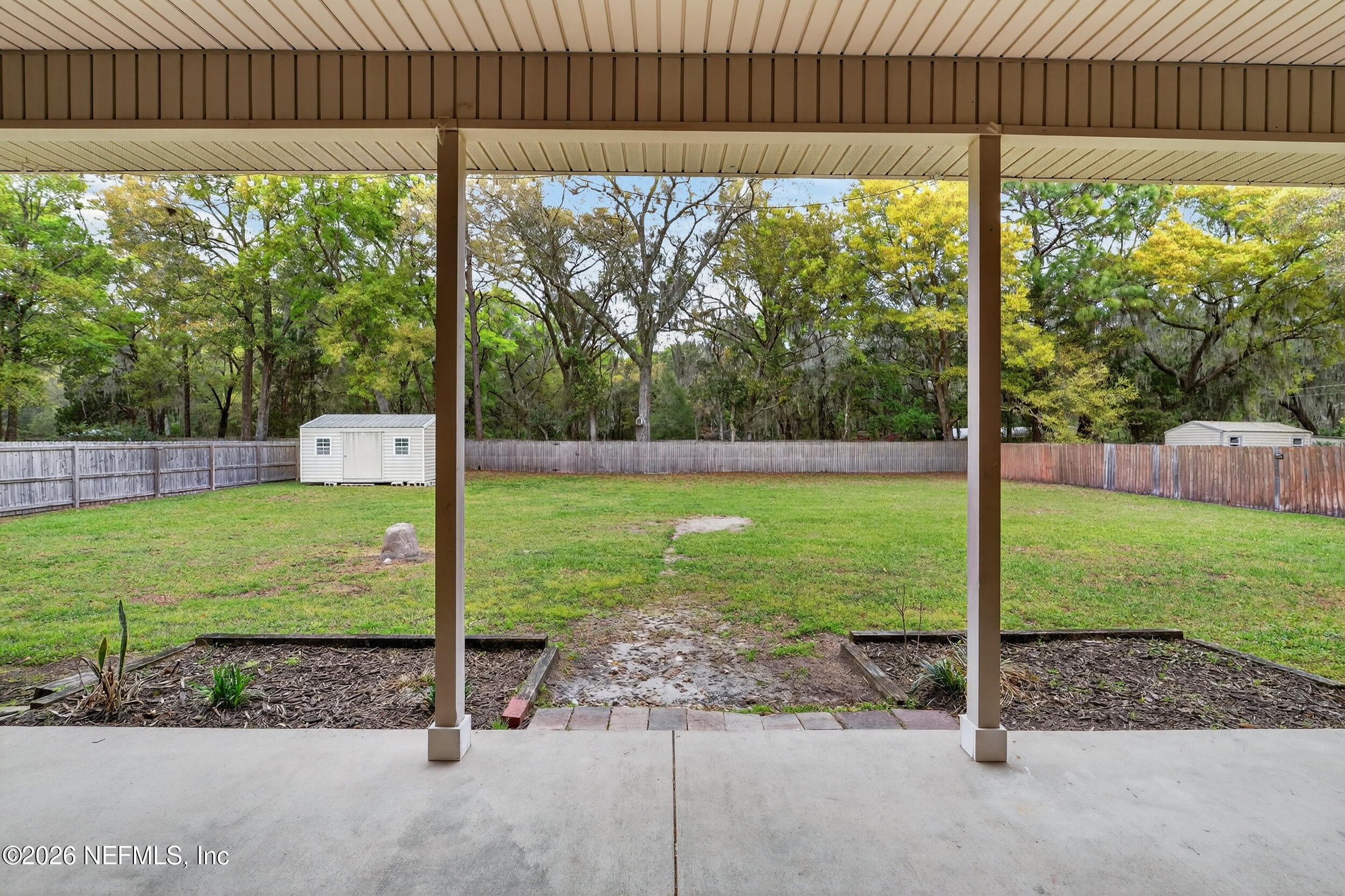 97076 Arnold Ridge Drive Yulee, FL 32097 - Photo 31 of 44 Covered rear patio