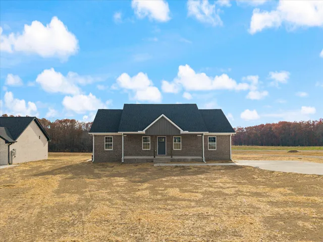 a house with a garden in the background