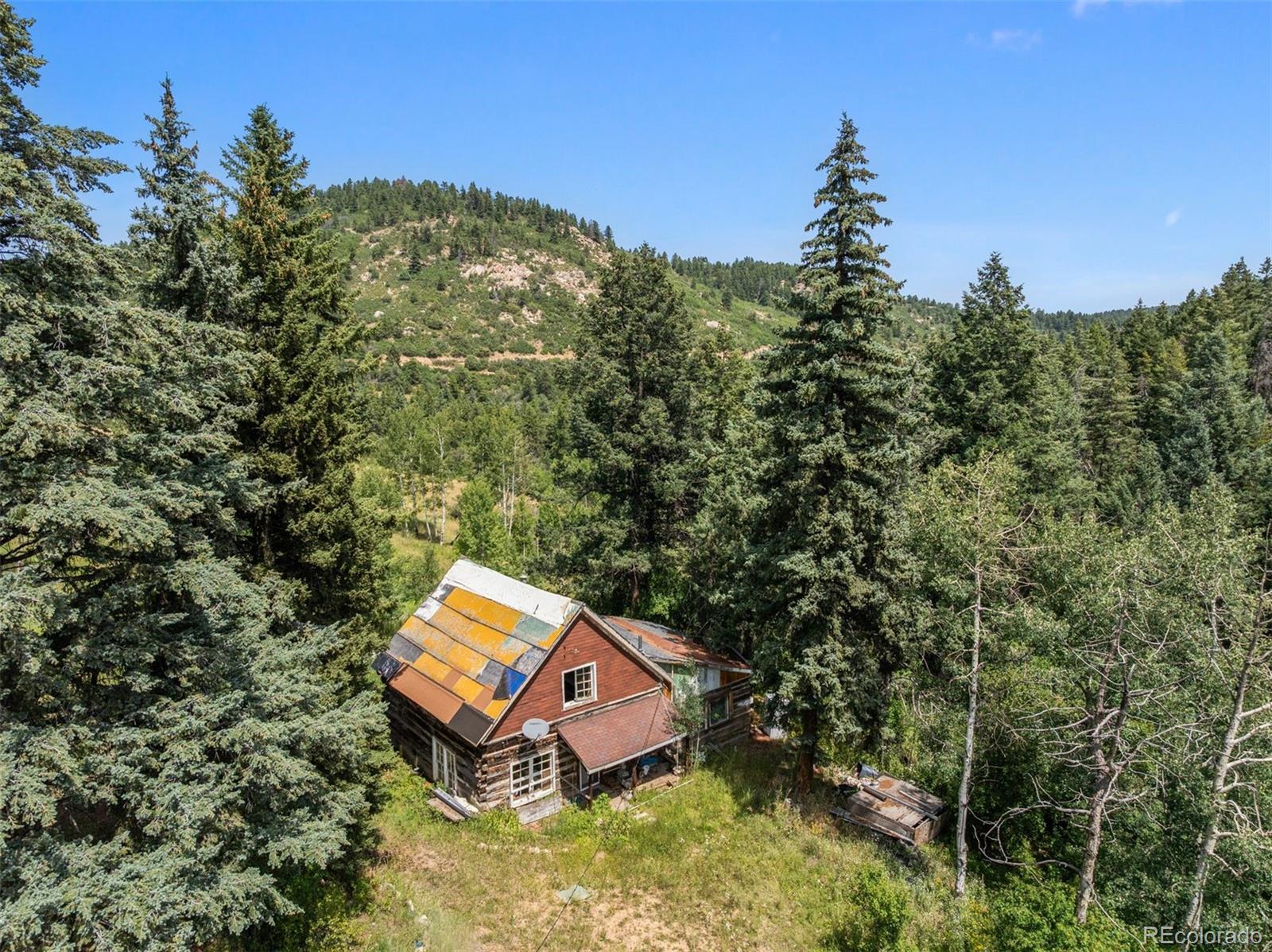12954 South Kuehster Road Littleton, CO 80127 - Photo 33 of 43 an aerial view of a house with yard and swimming pool