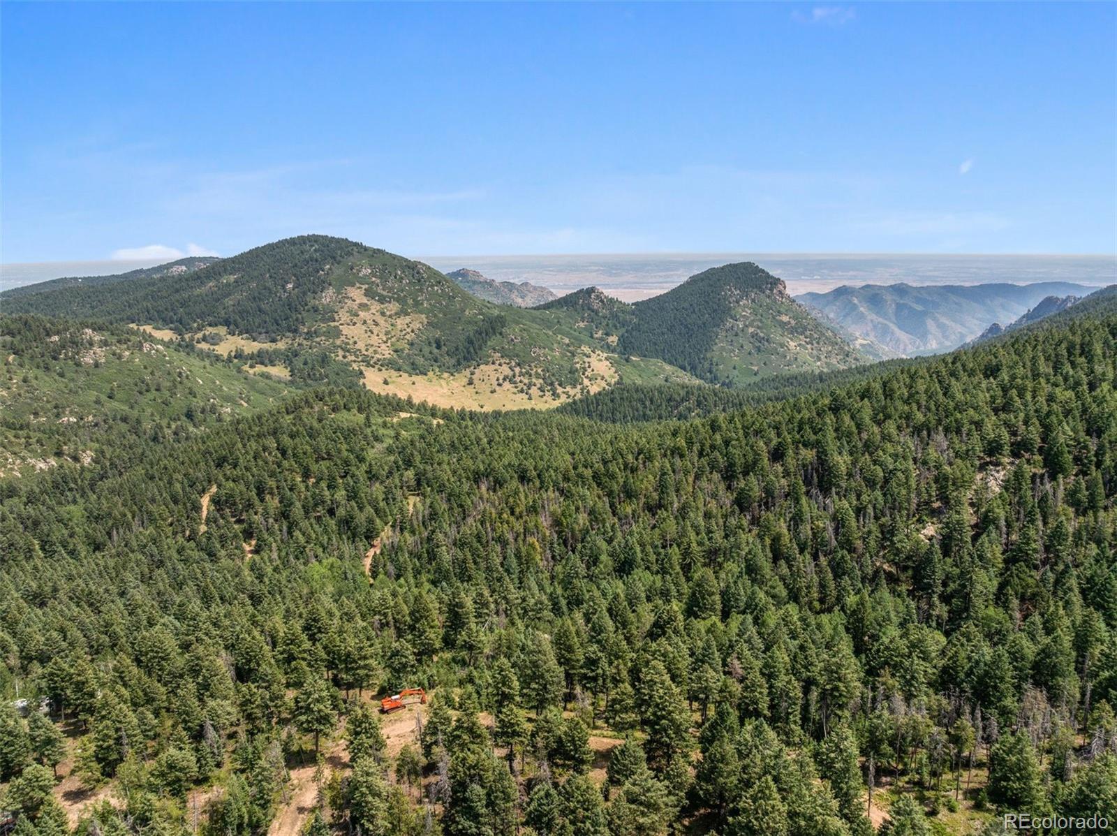 12954 South Kuehster Road Littleton, CO 80127 - Photo 35 of 43 a view of a mountain range in a cloudy sky