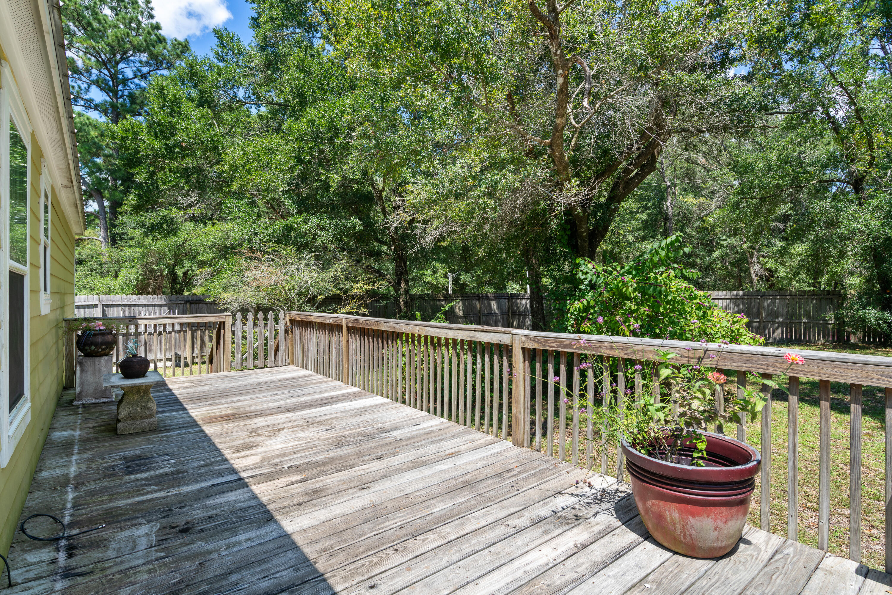 155-161 Caswell Branch Road Freeport, FL 32439 - Photo 13 of 24 a balcony with wooden floor and fence