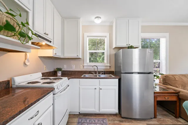 a white refrigerator freezer sitting in a kitchen
