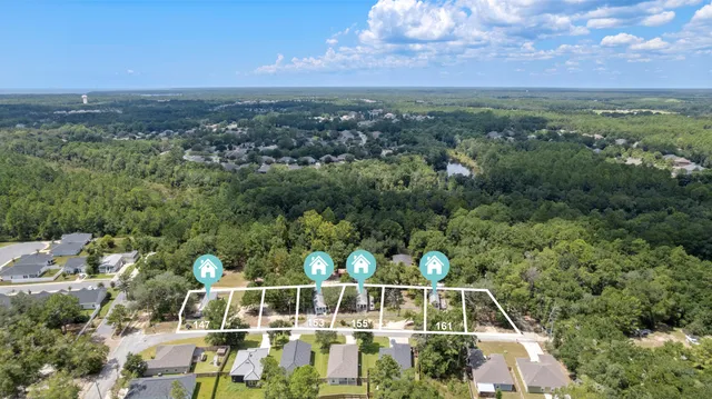 a view of a city with lush green forest