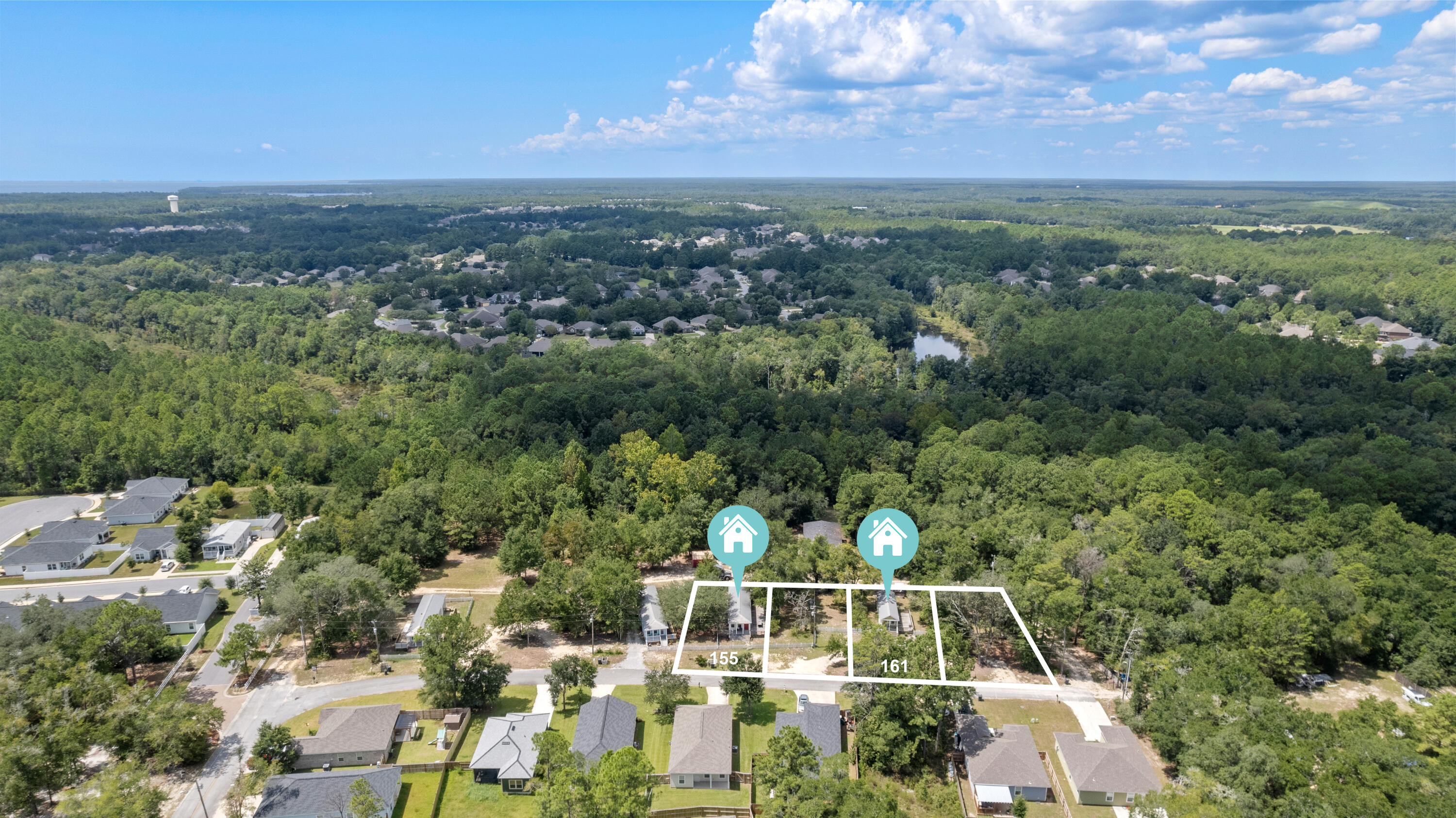 155-161 Caswell Branch Road Freeport, FL 32439 - Photo 24 of 24 a view of a city with lush green forest
