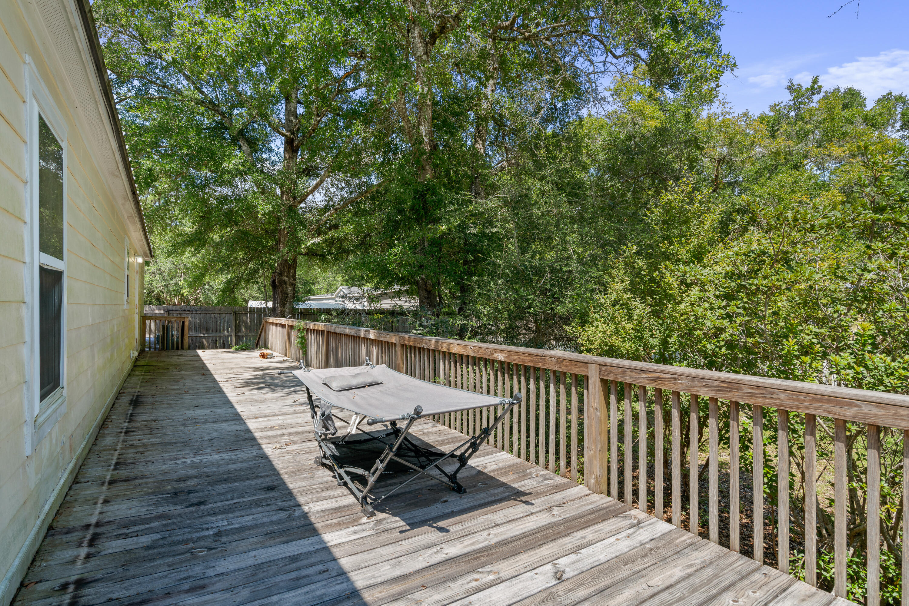 155-161 Caswell Branch Road Freeport, FL 32439 - Photo 3 of 24 a view of balcony with wooden floor and seating space