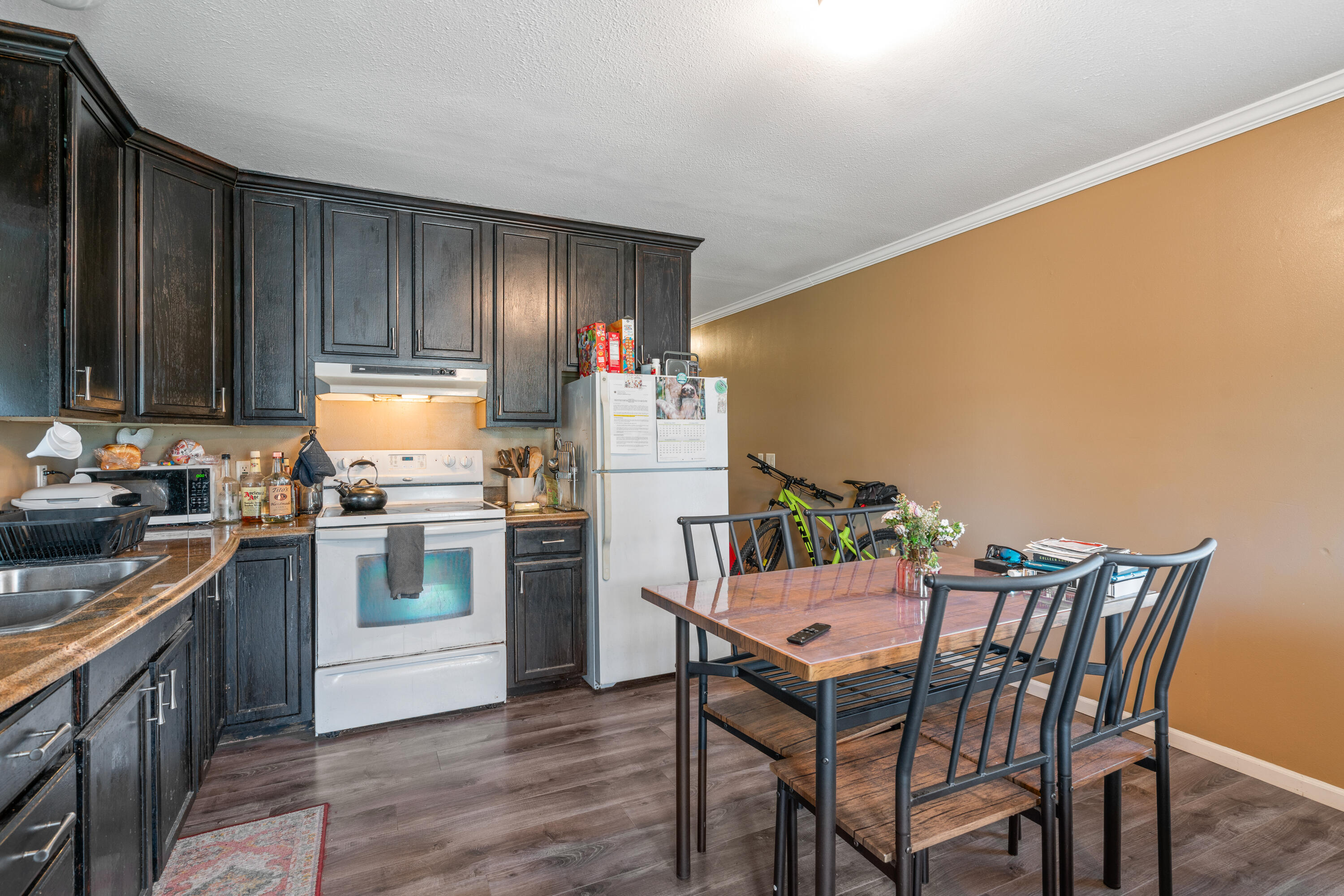 155-161 Caswell Branch Road Freeport, FL 32439 - Photo 7 of 24 a kitchen with a wooden table and chairs
