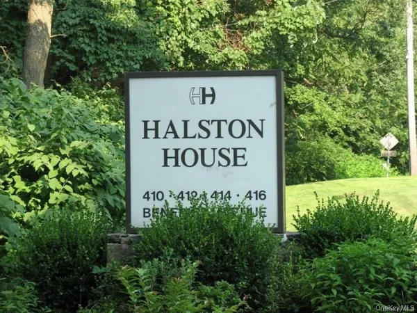 a sign broad on the side of the road