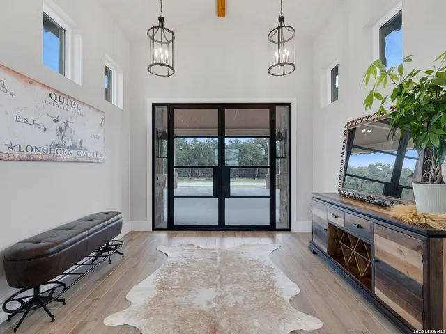 a bedroom with furniture and a potted plant