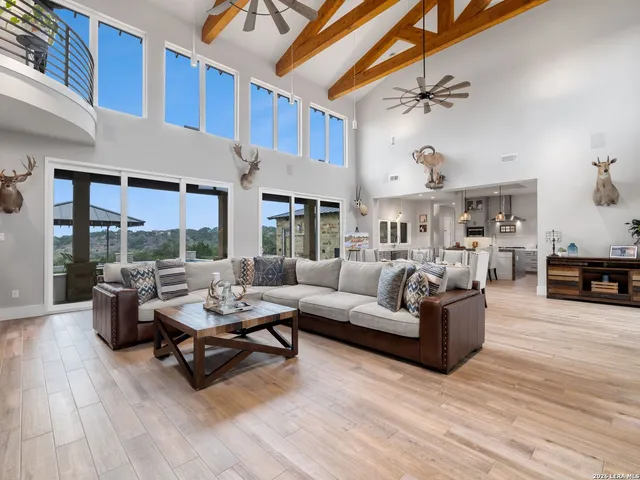 a dining room with furniture a fireplace and wooden floor