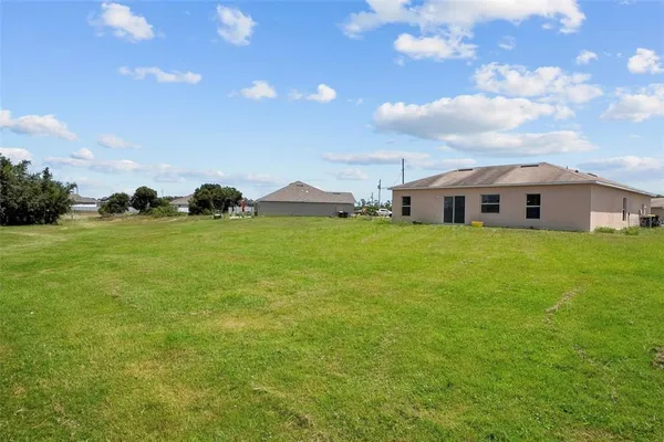 a view of a house with a big yard