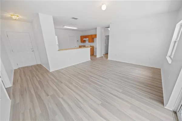 a view of a livingroom with wooden floor