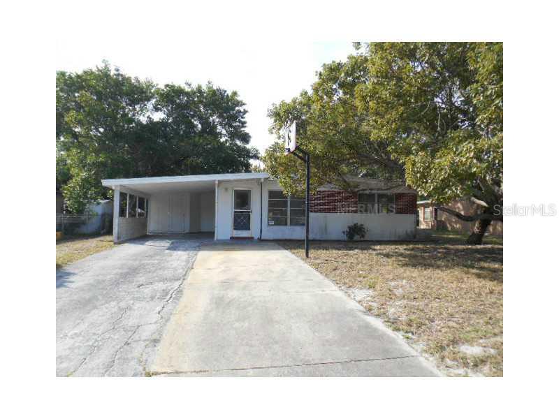 10713 Raffia Drive Port Richey, FL 34668 - Photo 1 of 1 a house view with a outdoor space