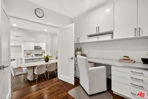 a view of kitchen with furniture and wooden floor