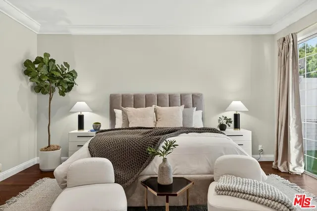 a bedroom with furniture and a bed