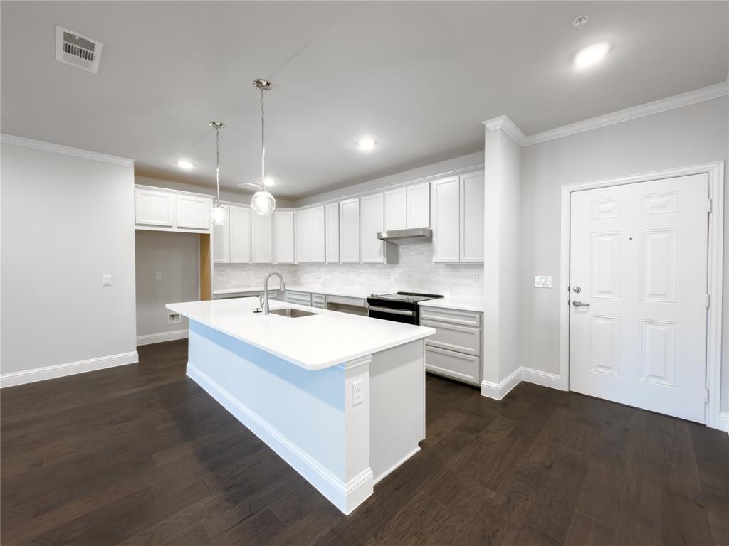 651 Watters Road, Unit 4202 Allen, TX 75013 - Photo 2 of 24 a kitchen with a sink a stove a refrigerator and a window