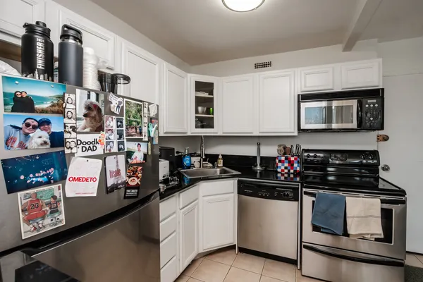 a kitchen with a sink and cabinets