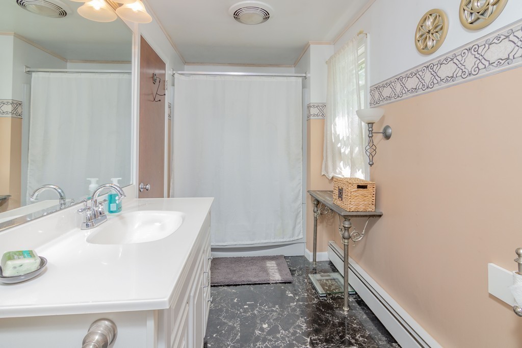 843 Blandford Road Russell, MA 01071 - Photo 18 of 27 a bathroom with a sink and a mirror
