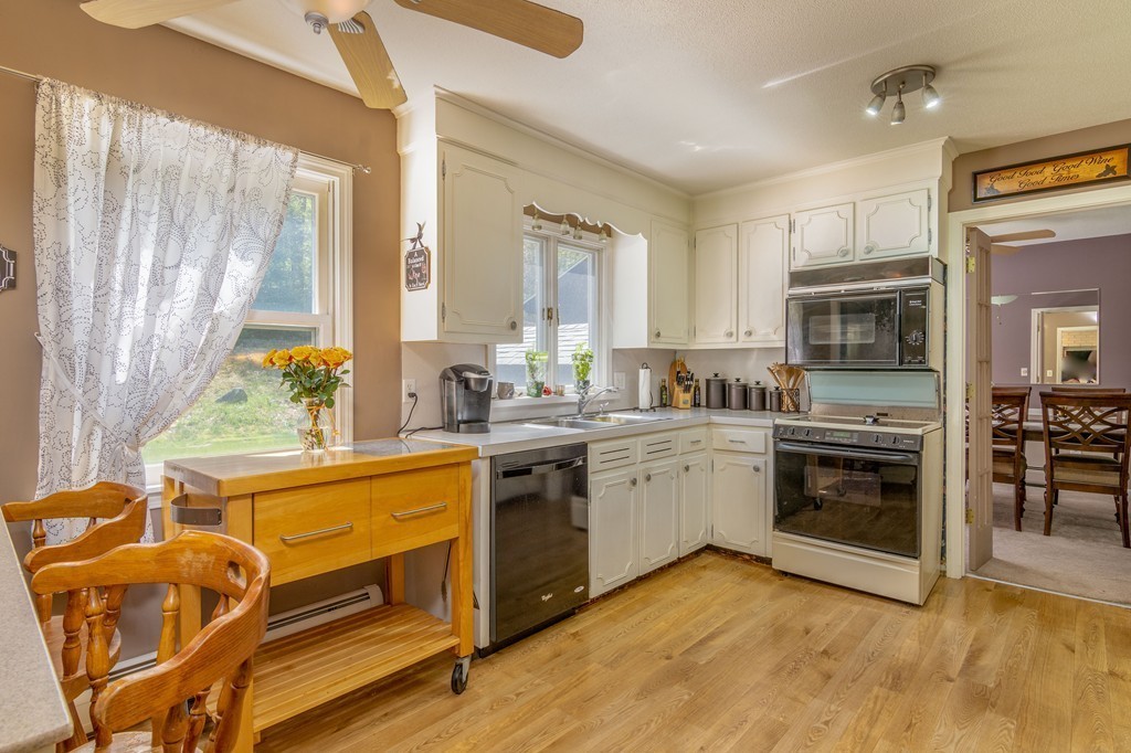 843 Blandford Road Russell, MA 01071 - Photo 8 of 27 a kitchen with stainless steel appliances granite countertop a stove and a sink