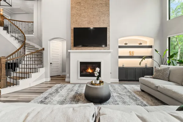 a living room with furniture and a fireplace