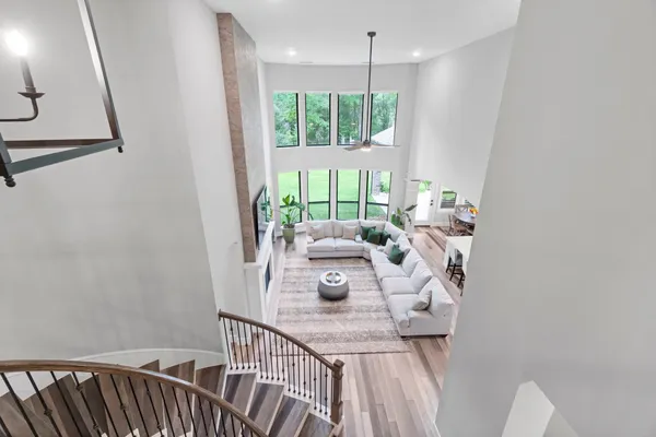 a kitchen with a granite countertop cabinets and chair