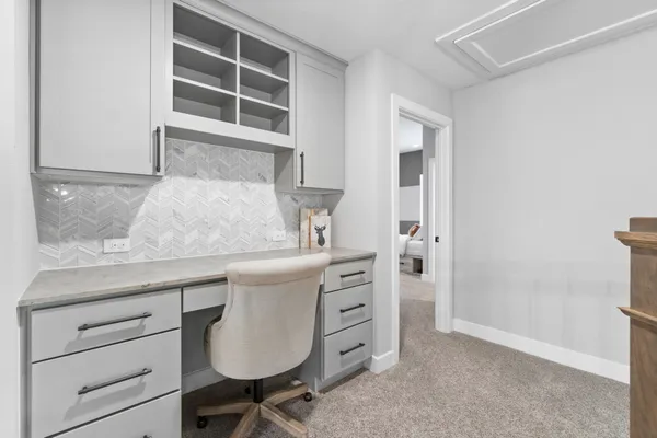 a room with pool table and windows